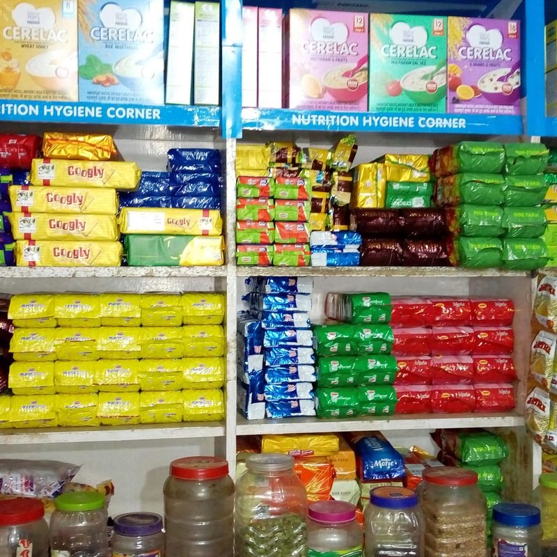 Well-stocked shelves of biscuits, cereals and packaged foods.